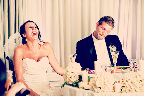 bride and groom lauging